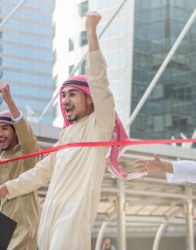 The arab man is running to go to the finish line and his competitor is behind (This photo taken at skywalk Chong Nonsi BTS Station which is public)